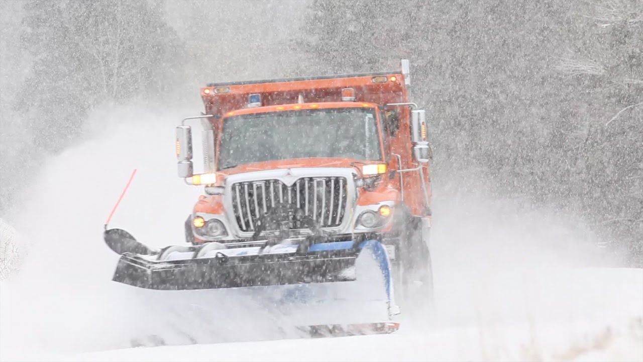 Plow truck pushing snow